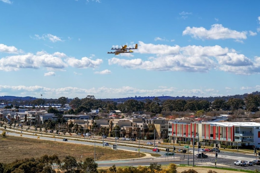 A drone flies high above a Canberra suburb.