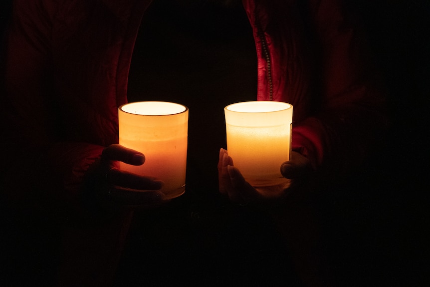 candles shine bright at a bondi vigil 210424