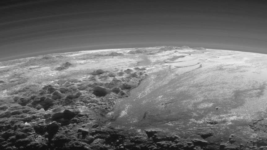 Close-up view of Pluto's mountains, frozen plains and hazes
