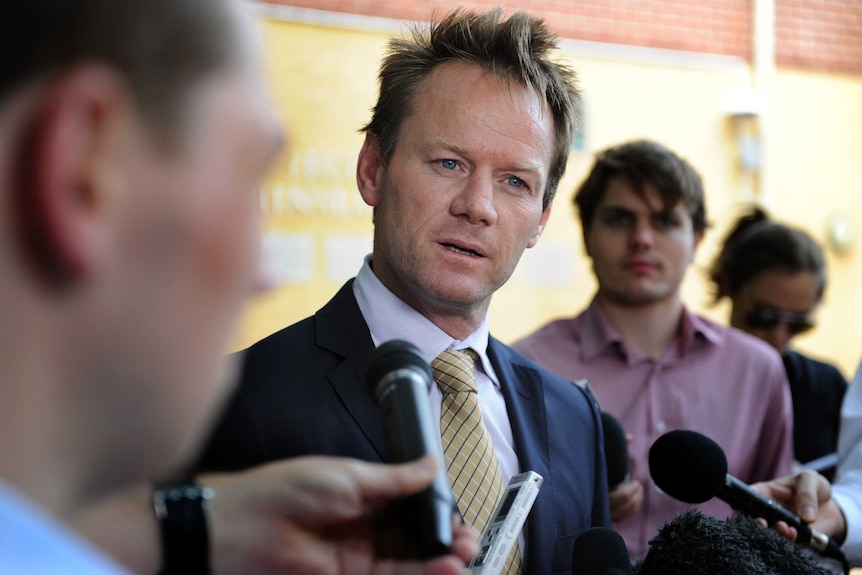 Cricket Australia's executive general manager of Team Performance, Pat Howard (centre), looks on during questioning at a press conference in Brisbane, March 12, 2013.