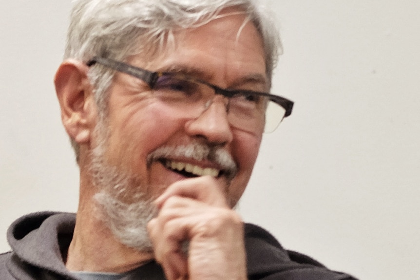 A man laughing.