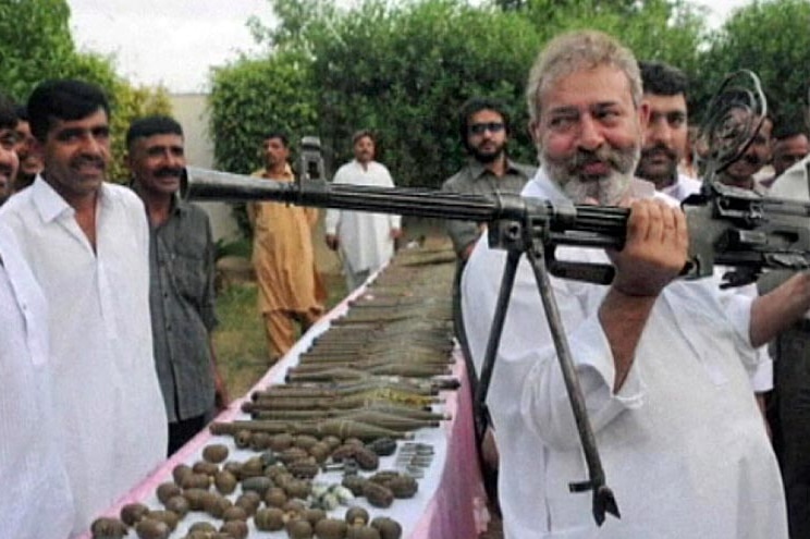 Chaudry Aslam Khan (holding gun), who was the head of anti-terror operations in Karachi, Pakistan.
