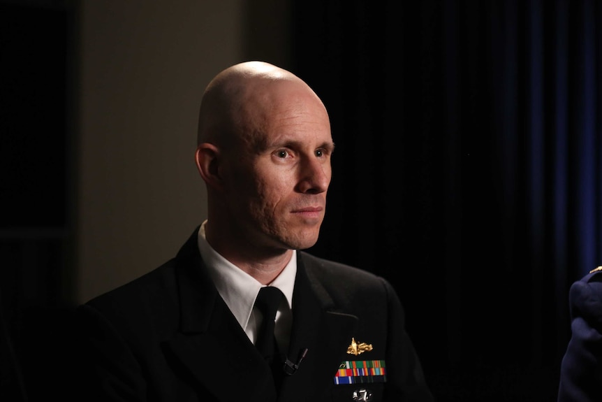 Lieutenant Commander Greg Young, US military lawyer who is representing Hambali, in 3/4 profile. IV for 7.30 February 2018