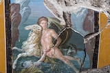 A fresco showing a boy on a sheep reaching to a girl