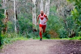 Stephen Giles running in his uniform