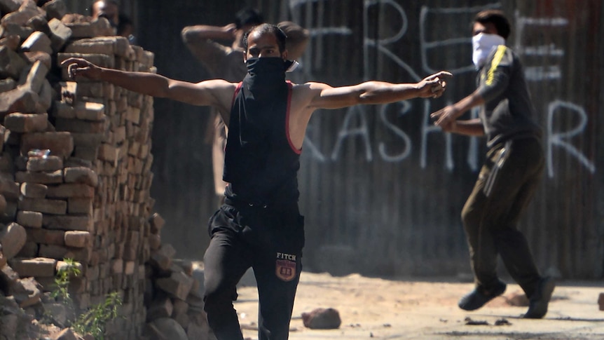 Kashmiri protestors clash with Indian government forces during a protest against civilian killings.