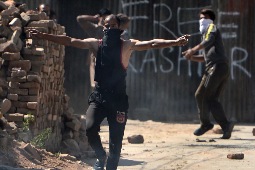 Kashmiri protestors clash with Indian government forces during a protest against civilian killings.