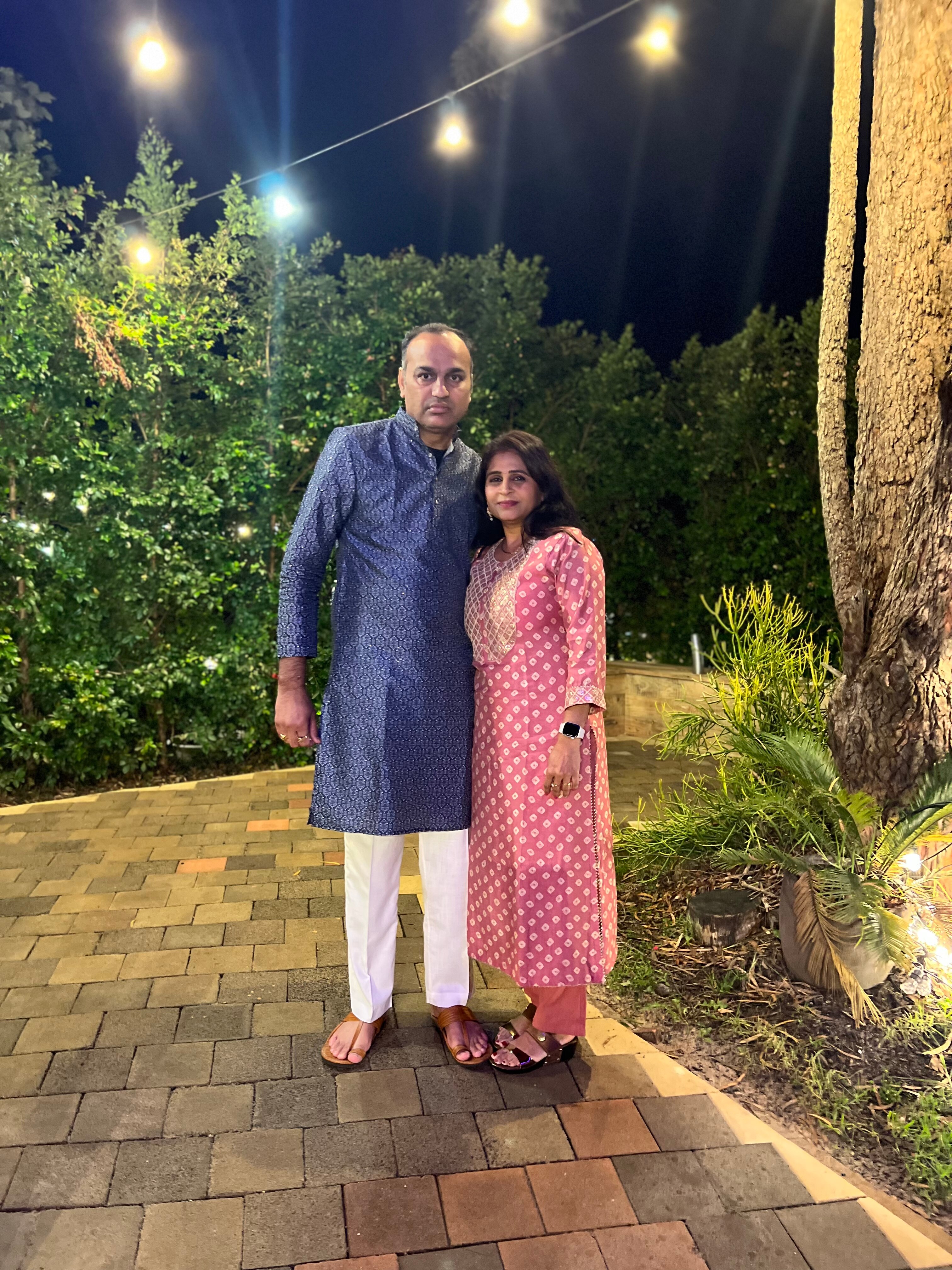 Yogita and Amit Patel wearing traditional Indian clothing.