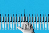 An illustration shows a gloved hand holding a syringe, with a row of syringes behind it.