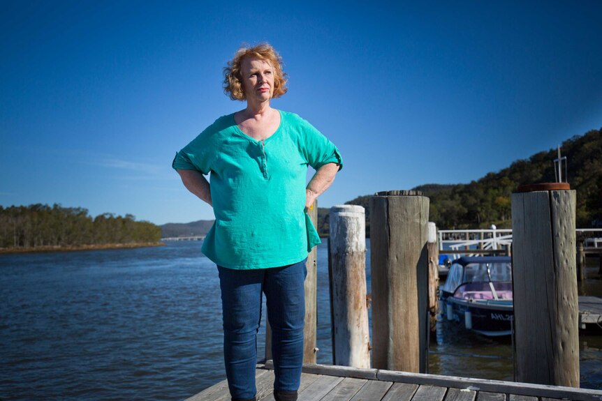 Marion Rae stands on a jetty on the Hawkesbury River