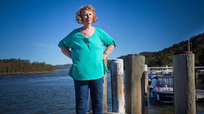 Marion Rae stands on a jetty on the Hawkesbury River
