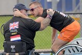 Paul Guest is comforted by Edwin Vermetten a helicopter flying over the Invictus Games unsettled him.