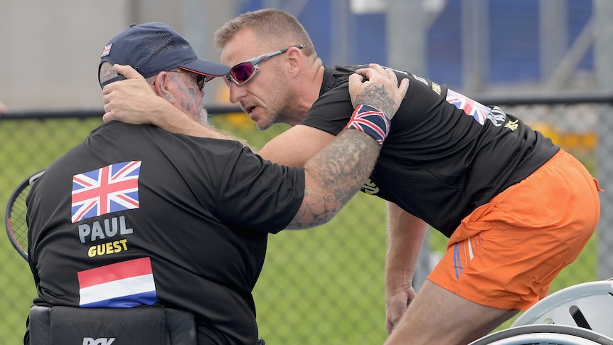 Paul Guest is comforted by Edwin Vermetten a helicopter flying over the Invictus Games unsettled him.