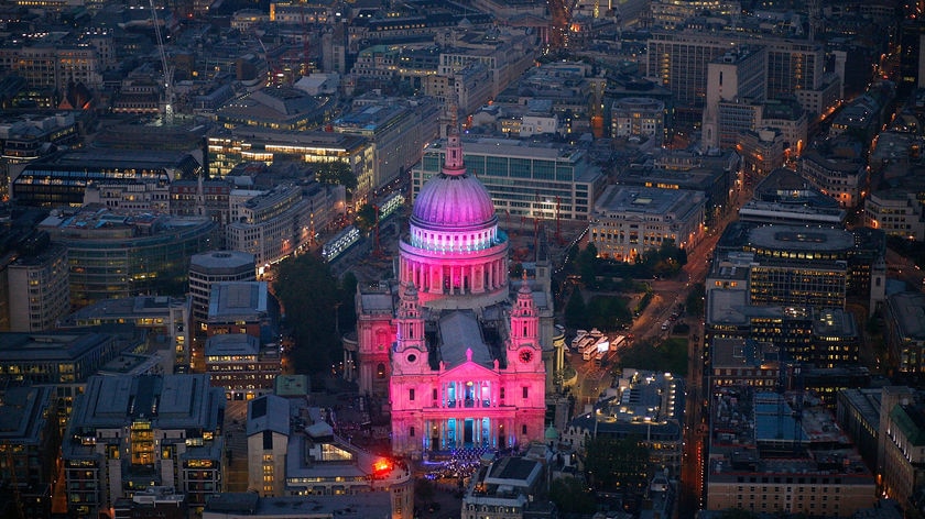 Coloured floodlights illuminate St Paul's Cathedral in London