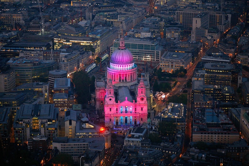 Coloured floodlights illuminate St Paul's Cathedral in London