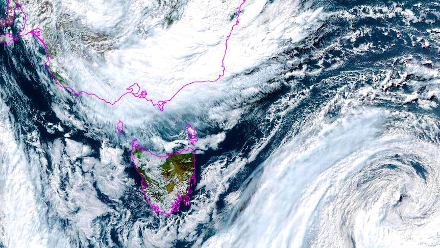 A satellite image of intense white clouds to above east of Tasmania 