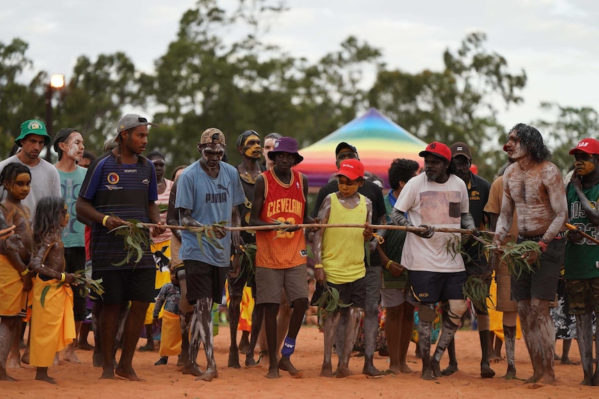 Yolngu dancers walk together at Garma Festival in the Northern Territory.