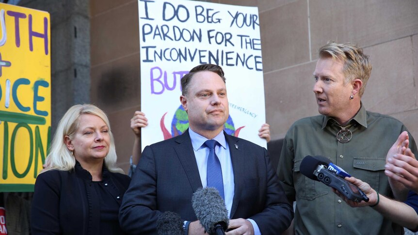 Brisbane's Lord Mayor Adrian Schrinner was heckled by climate protesters