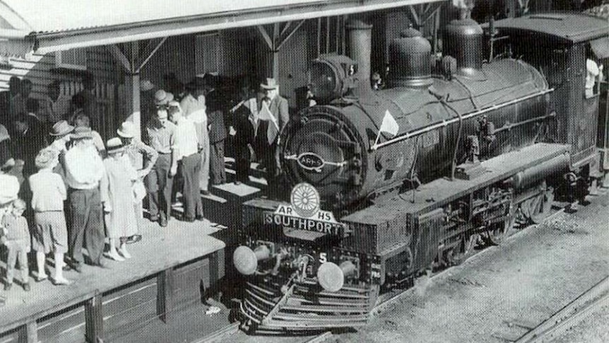 Crowds wait for a Southport train on the old rail line.