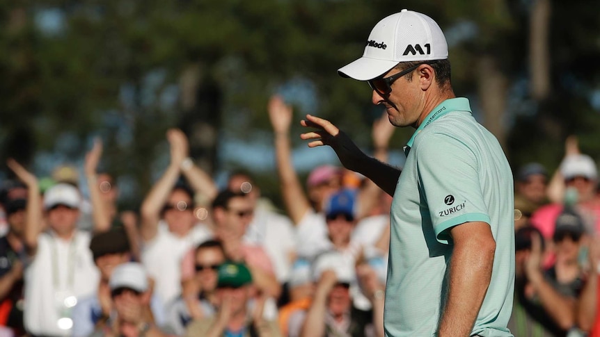 England's Justin Rose reacts to his birdie on the 18th hole in the third round of the Masters.