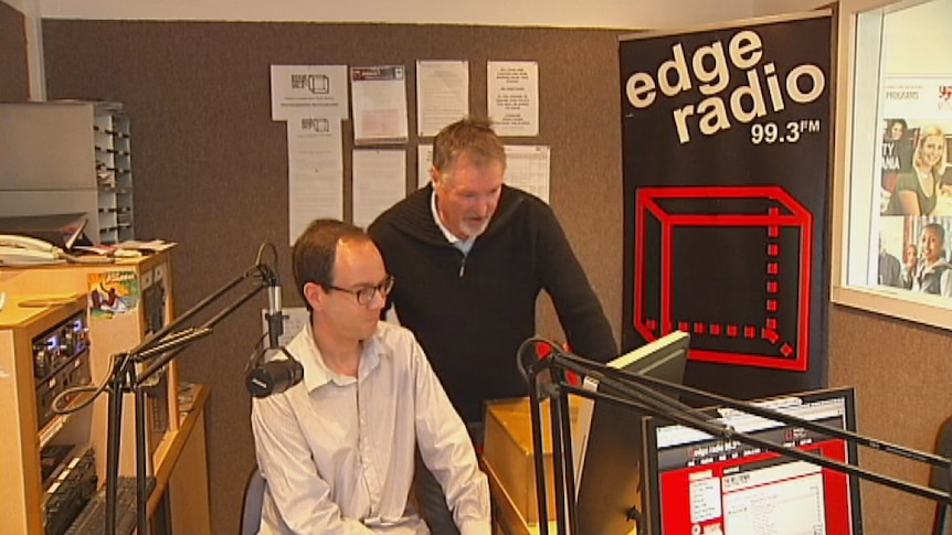 Edge Radio Station Manager Mark Cutler supervises a student. Video still