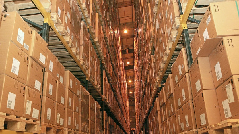 Boxes stacked up on shelves of antiviral drug Tamiflu at a UK warehouse on April 29, 2009.
