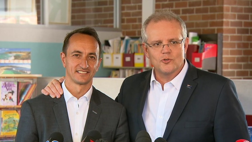 Prime Minister Scott Morrison with his arm around the Liberal's Wentworth candidate Dave Sharma