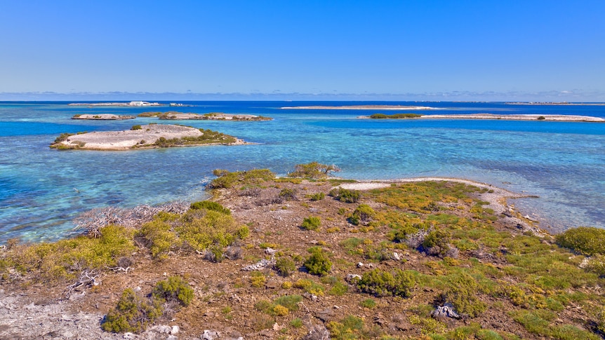 A group of several islands surrounded by clear waters