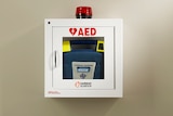 A wall-mounted automated external defibrillator