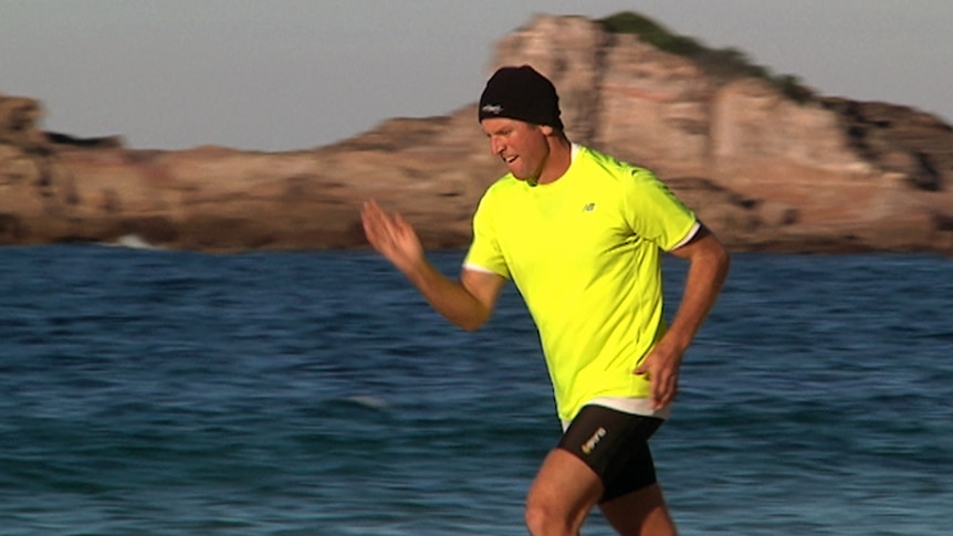 Dane Waites training on a beach near Pambula in preparation for his run across Australia