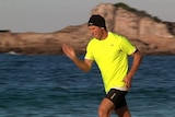 Dane Waites training on a beach near Pambula in preparation for his run across Australia