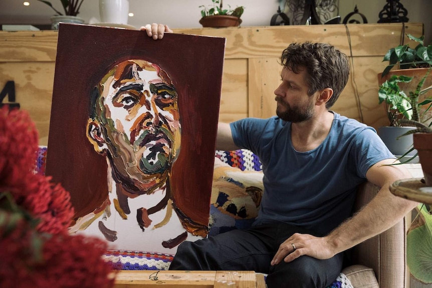 Artist Ben Quilty with a painting by Myuran Sukumaran