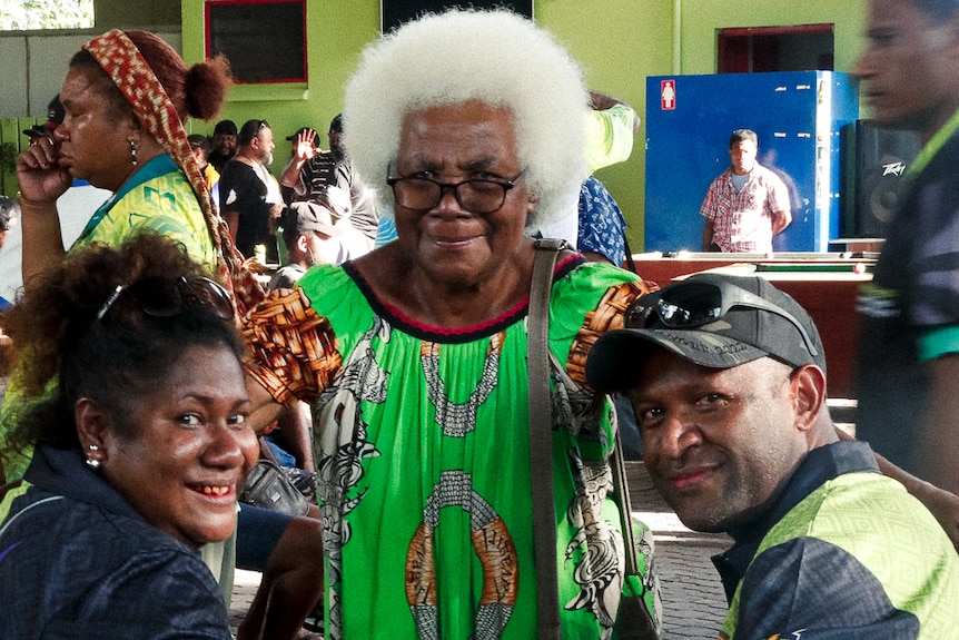 Darts team with senior woman