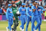 Cricket players from both teams walk off the ground after a World Cup match.