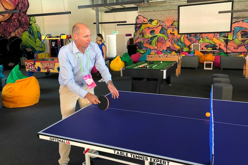 Tom Forbes plays table tennis at the Athlete's Village during a media visit on March 19, 2018.