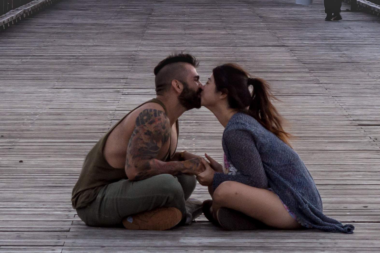 Do you know these lovebirds? Photographer takes to Facebook to seek out kissing couple