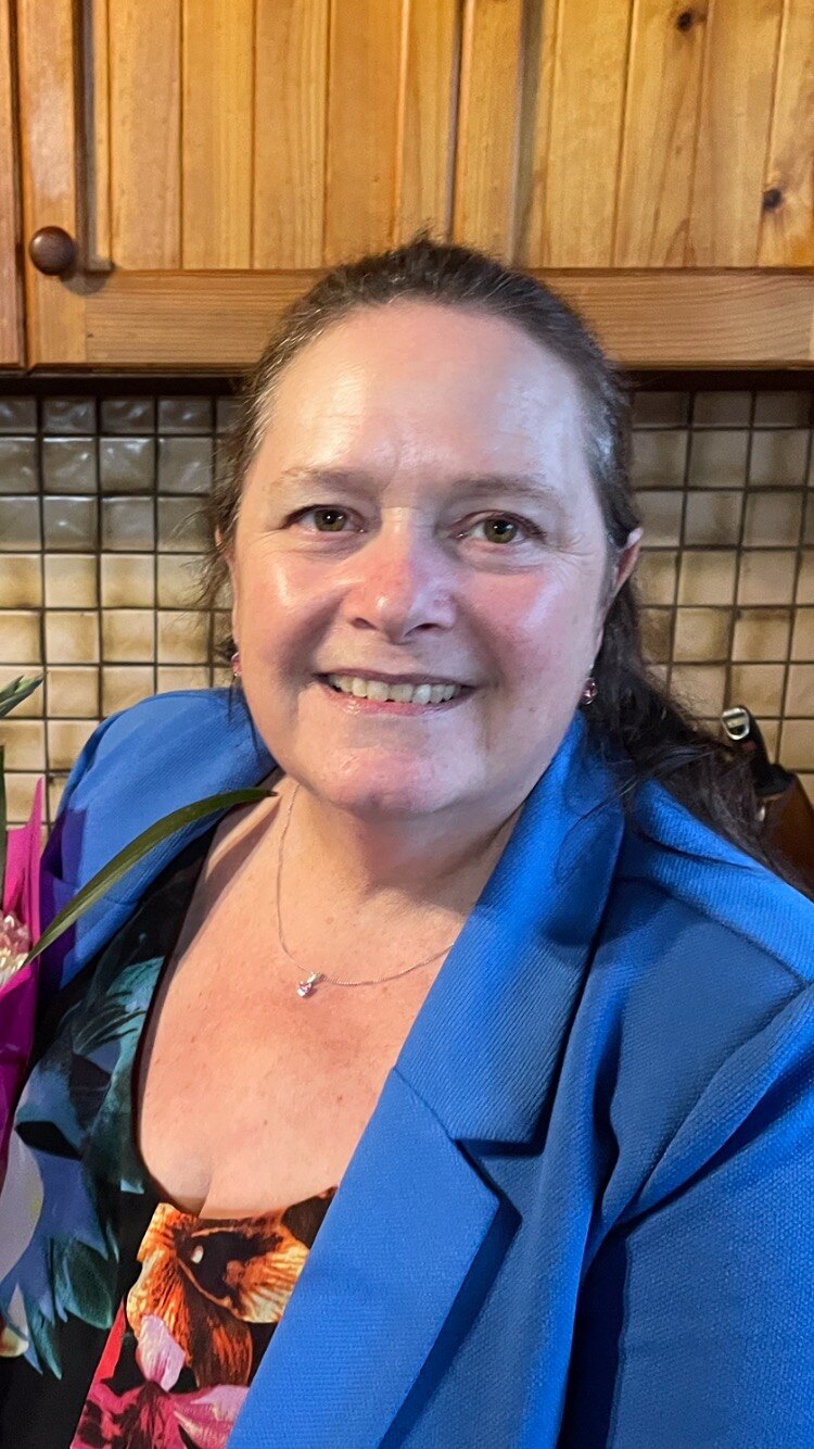 A woman smiling at the camera