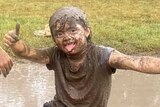Kid in mud