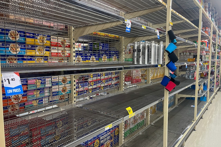 Empty shopping centre shelves.