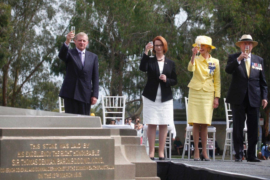 Toasting Canberra's centenary at the foundation stone.