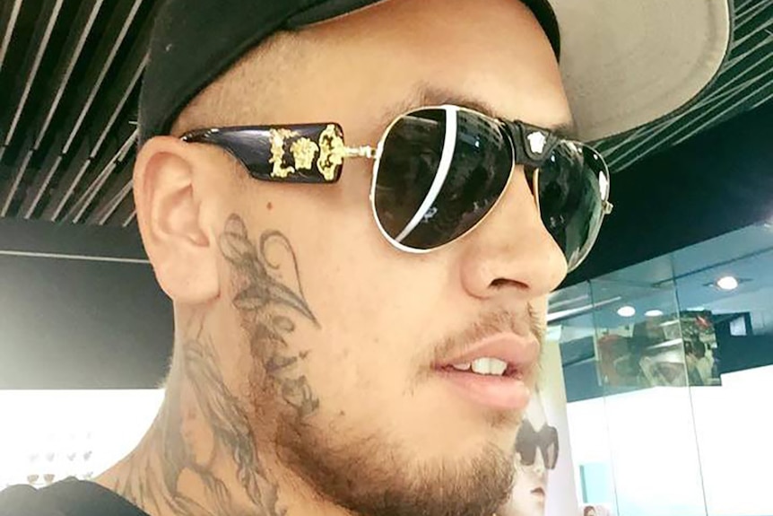 Lionel Patea in a cap and sunglasses