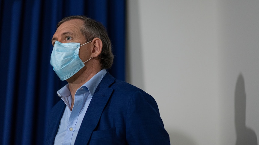 Chief Minister Michael Gunner, wearing a mask, speaking at a COVID press conference at NT Parliament House.