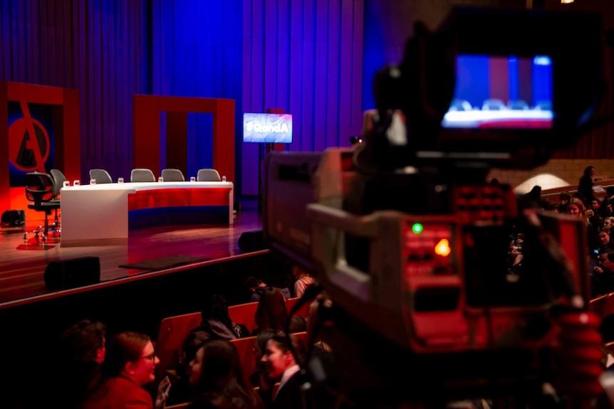 A camera is filming the broadcast of Q&A at ANU.