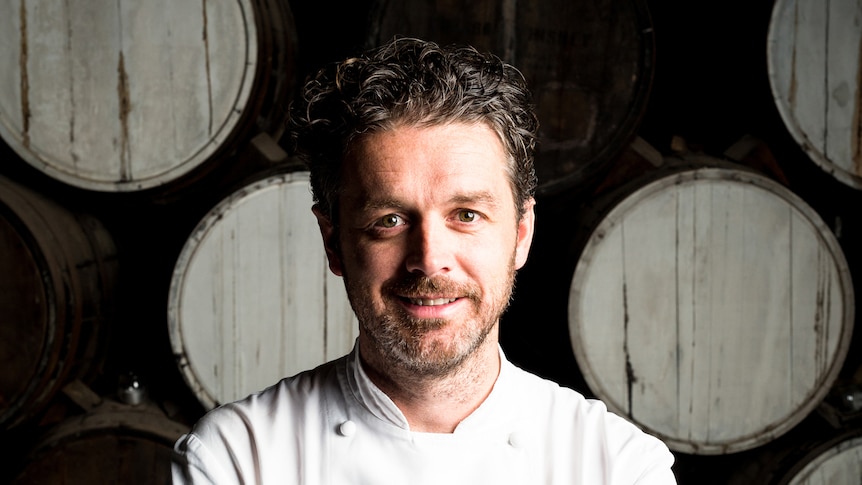 A man in a chef's uniform.