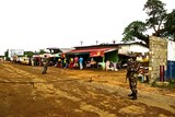 Soldiers guard border checkpoint in Liberia to help control spread of Ebola