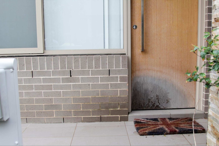 Water damage on the front door of a unit at Centenary Park in Sydney.