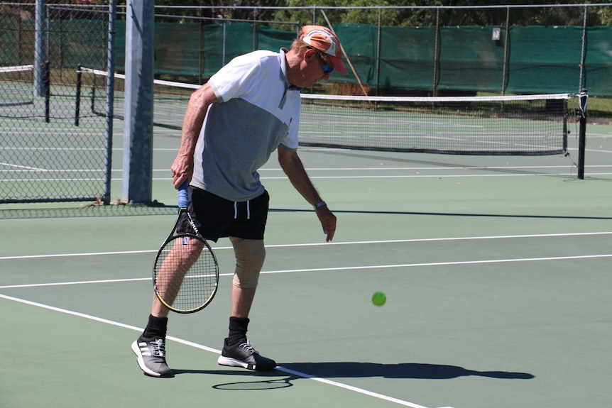 A photo of Geoff Rowbotham playing tennis at a Kingsley court.