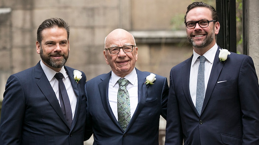 Lachlan, Rupert and James Murdoch dressed for Rupert's wedding with corsages