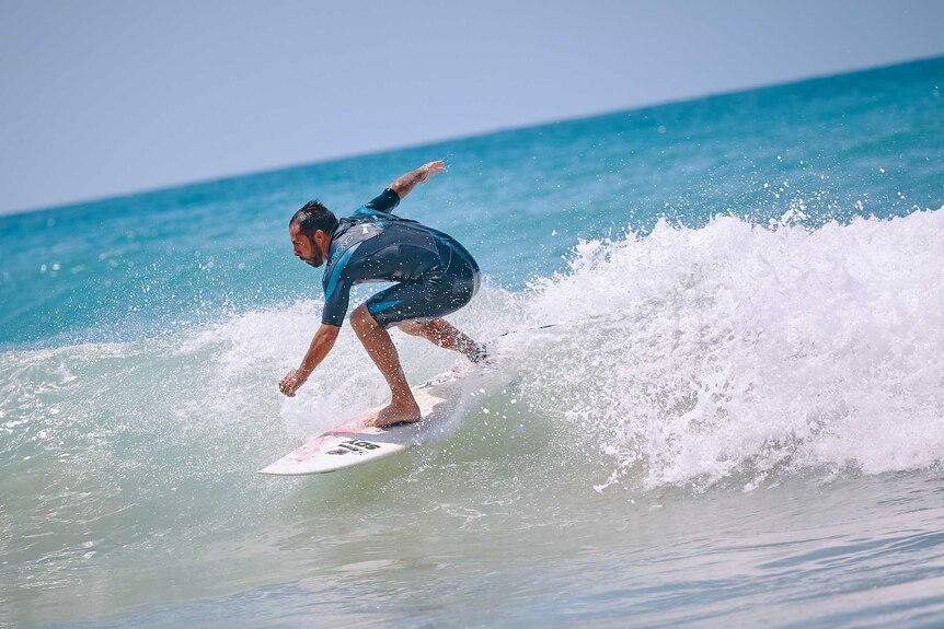 Man surfs in the ocean