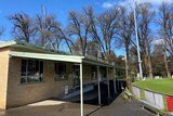 A photo of an old brick sports pavilion at a football oval.